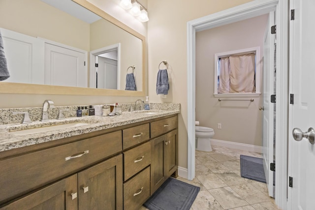 bathroom with vanity and toilet