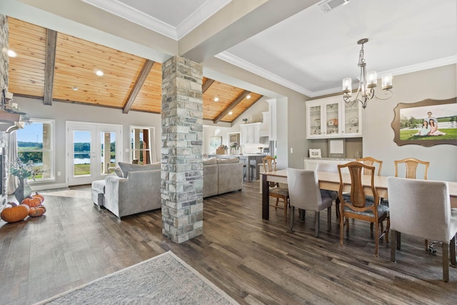 dining area with french doors, lofted ceiling with beams, decorative columns, dark hardwood / wood-style flooring, and wooden ceiling