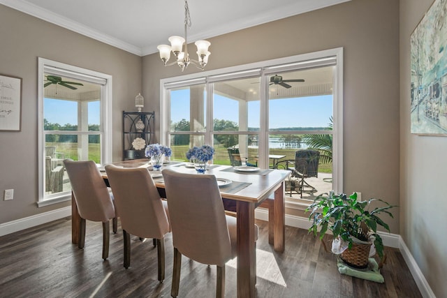 dining area featuring ornamental molding, a water view, ceiling fan with notable chandelier, and dark hardwood / wood-style flooring