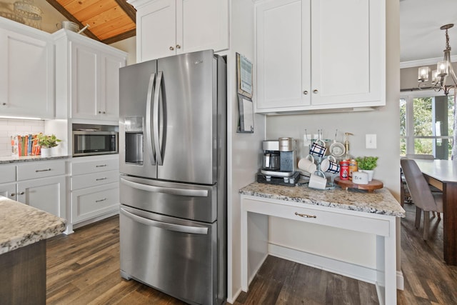 kitchen with white cabinetry, stainless steel appliances, dark hardwood / wood-style floors, and wooden ceiling