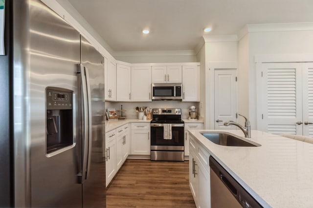 128 Date Palm Ln, Freeport, FL 32439 - kitchen featuring stainless steel appliances, a sink, white cabinets, dark wood finished floors, and recessed lighting