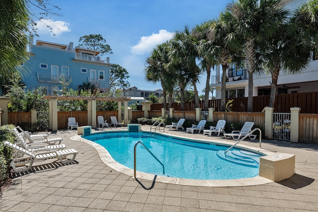 view of pool featuring a patio and a pergola