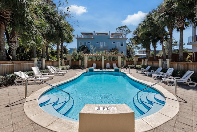 view of swimming pool featuring a patio area