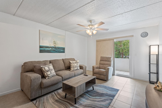 209 W Miracle Strip Pkwy Unit J201, Mary Esther, FL 32569 - living area with a textured ceiling, ceiling fan, tile patterned floors, and baseboards