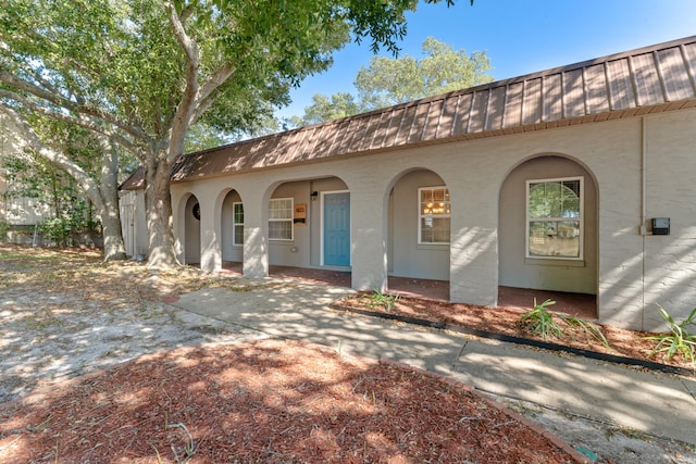 mediterranean / spanish home with a porch