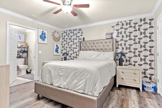 bedroom with hardwood / wood-style flooring, ceiling fan, crown molding, and ensuite bathroom