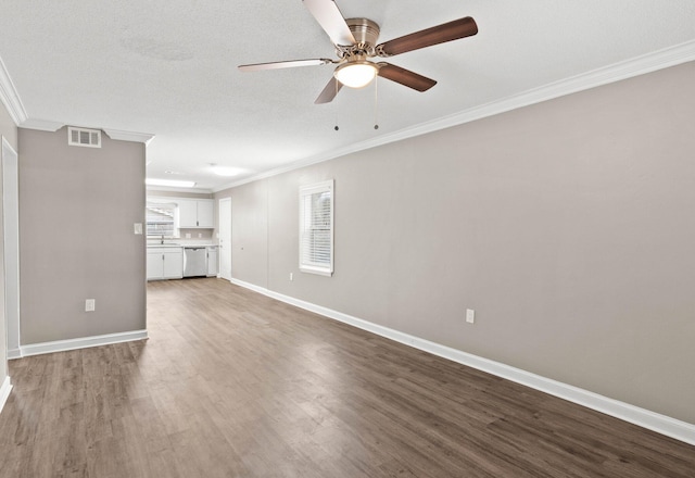 unfurnished living room with a textured ceiling, hardwood / wood-style flooring, ceiling fan, and crown molding