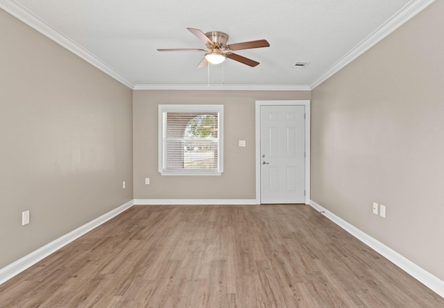 unfurnished room with ceiling fan, light hardwood / wood-style floors, and ornamental molding