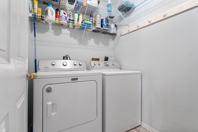 laundry room featuring washing machine and dryer