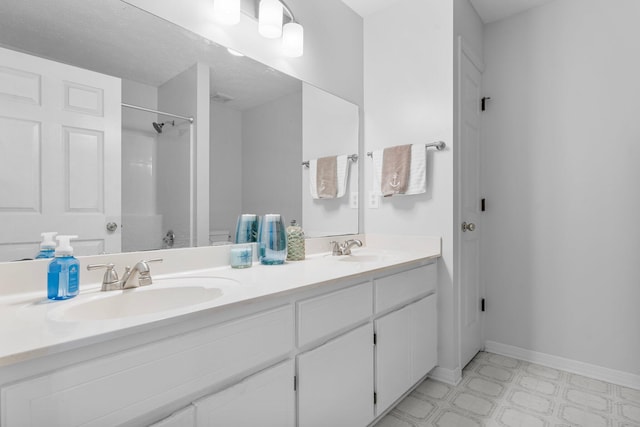 bathroom with vanity and walk in shower