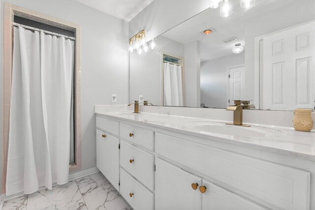 bathroom featuring vanity and a shower with curtain