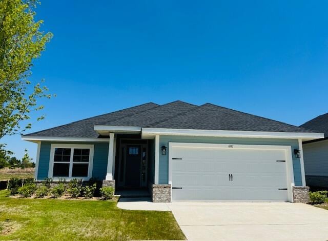 601 Alleyoak Ln Lot 11-2, Freeport, FL 32439 - view of front of property with a garage, driveway, a front lawn, stone siding, and roof with shingles