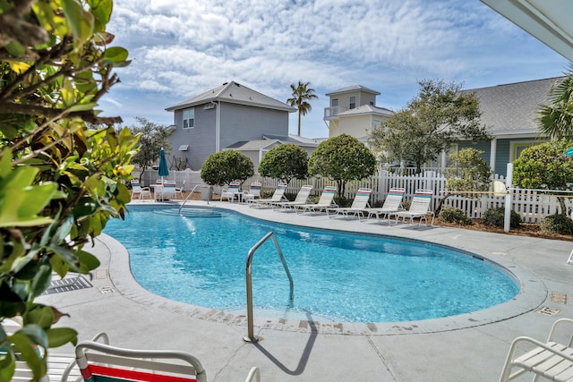 view of swimming pool featuring a patio area