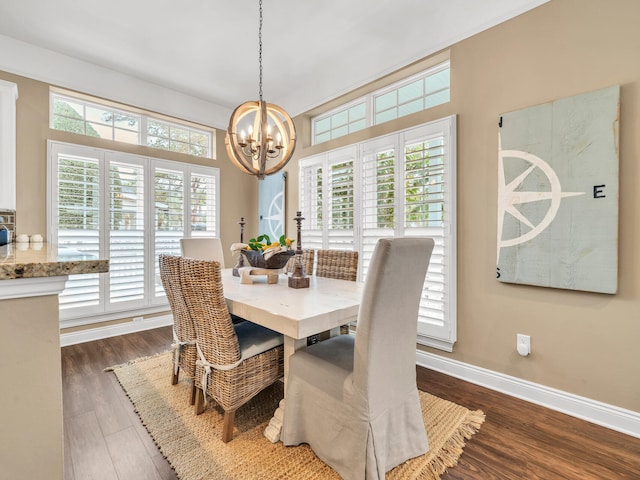 dining area featuring a chandelier and dark wood-type flooring