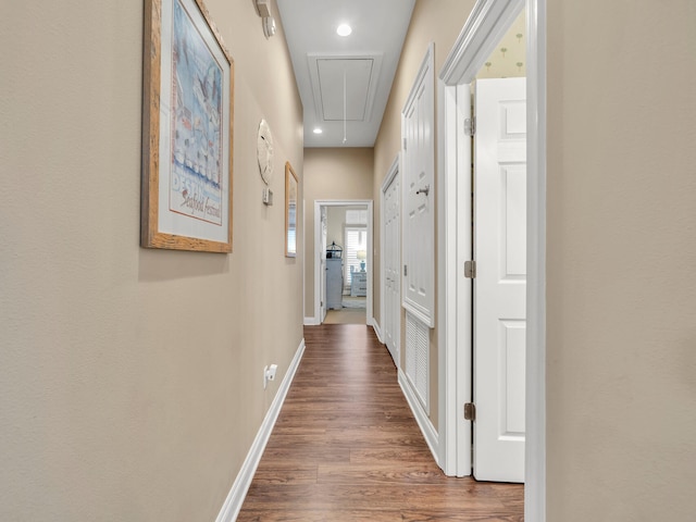 hallway with wood-type flooring