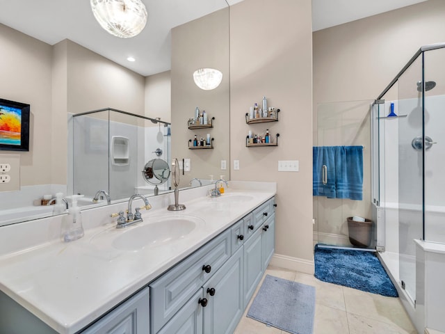 bathroom featuring tile patterned flooring, vanity, and a shower with shower door