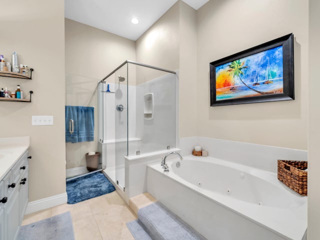 bathroom with tile patterned floors, vanity, and shower with separate bathtub