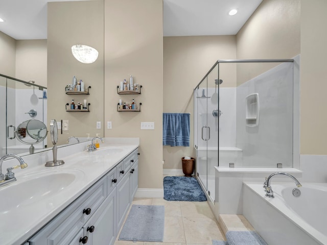 bathroom with plus walk in shower, vanity, and tile patterned floors