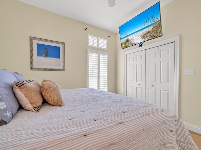 bedroom featuring ceiling fan and a closet