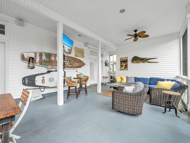 sunroom featuring ceiling fan