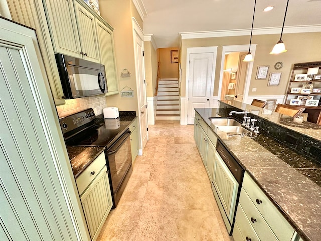 kitchen featuring green cabinetry, black appliances, sink, pendant lighting, and dark stone countertops