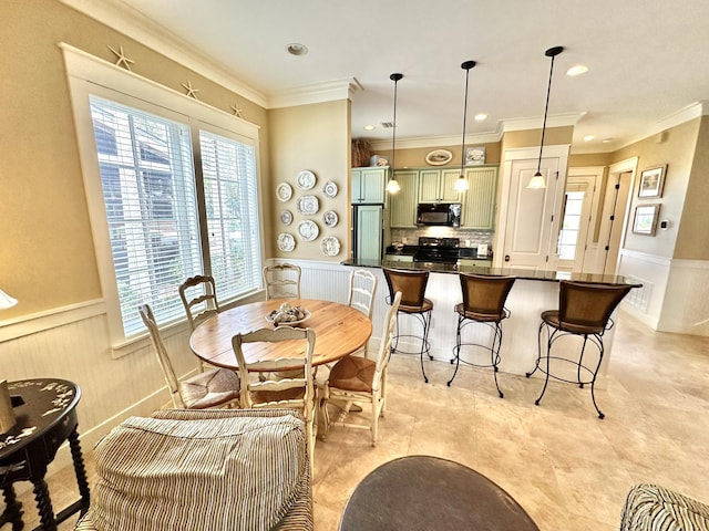 2450 Bungalo Ln, Miramar Beach, FL 32550 - dining area featuring a wainscoted wall, crown molding, and recessed lighting