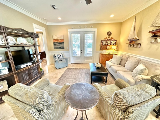 living room with ornamental molding, french doors, and ceiling fan