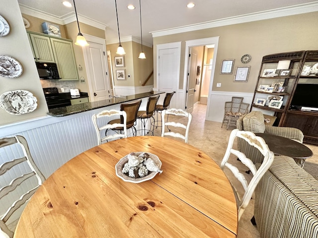 2450 Bungalo Ln, Miramar Beach, FL 32550 - dining room featuring a wainscoted wall, recessed lighting, ornamental molding, and stairs