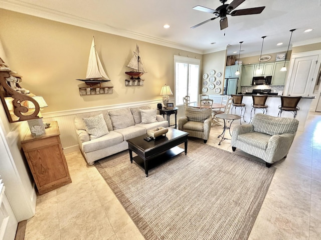 2450 Bungalo Ln, Miramar Beach, FL 32550 - living area featuring ceiling fan, ornamental molding, recessed lighting, a wainscoted wall, and light tile patterned floors