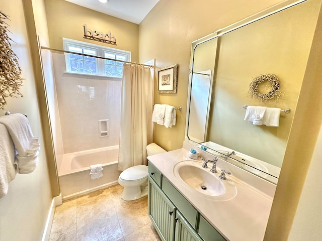 full bathroom featuring tile patterned floors, vanity, shower / bath combo with shower curtain, and toilet