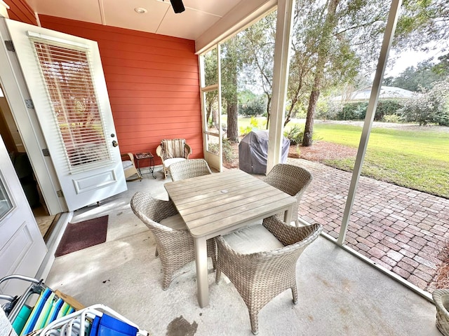 sunroom / solarium with ceiling fan