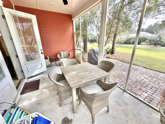 2450 Bungalo Ln, Miramar Beach, FL 32550 - sunroom featuring a ceiling fan and outdoor dining space