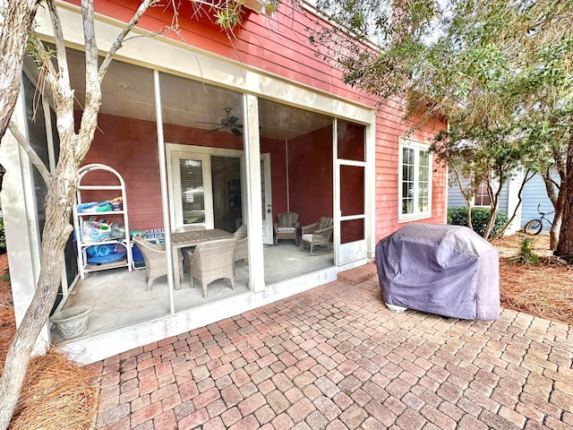 view of patio with area for grilling and ceiling fan