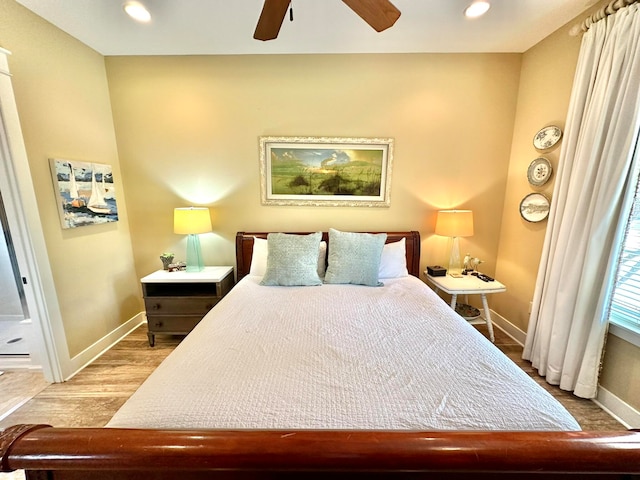 bedroom with hardwood / wood-style flooring and ceiling fan