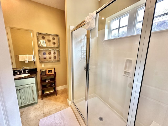 2450 Bungalo Ln, Miramar Beach, FL 32550 - full bath with a stall shower, vanity, tile patterned floors, and baseboards