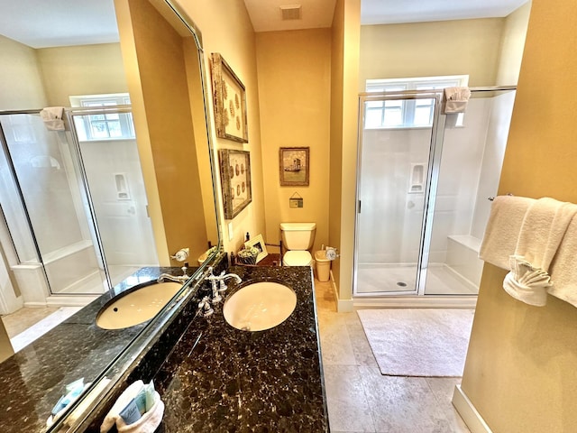 2450 Bungalo Ln, Miramar Beach, FL 32550 - bathroom featuring a stall shower, toilet, vanity, tile patterned flooring, and baseboards