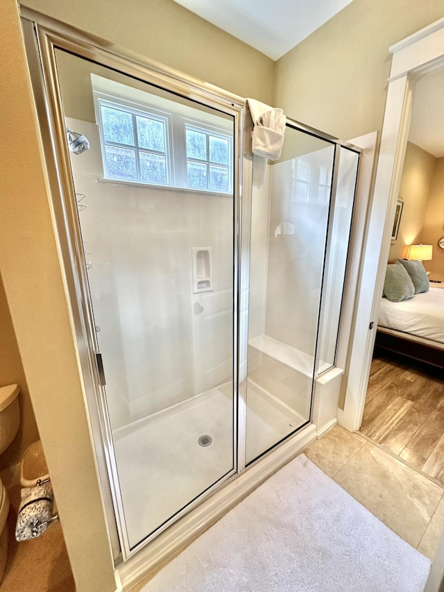 2450 Bungalo Ln, Miramar Beach, FL 32550 - full bathroom featuring ensuite bath, a shower stall, tile patterned flooring, and toilet