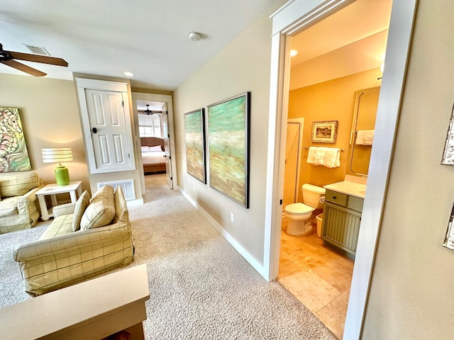 corridor featuring lofted ceiling and light carpet