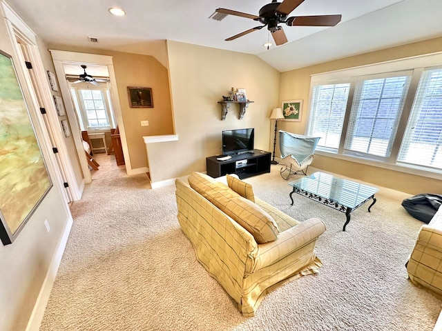 living room with vaulted ceiling, light carpet, and ceiling fan