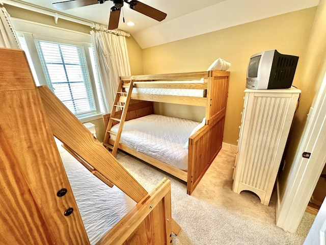 2450 Bungalo Ln, Miramar Beach, FL 32550 - bedroom featuring light carpet, vaulted ceiling, ceiling fan, and baseboards