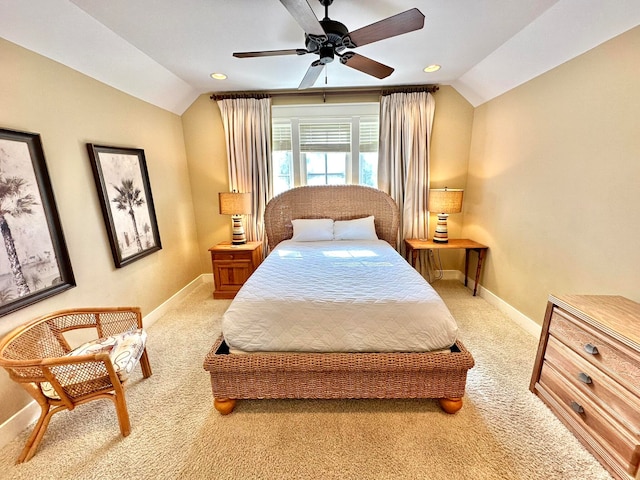 bedroom with light carpet, ceiling fan, and vaulted ceiling