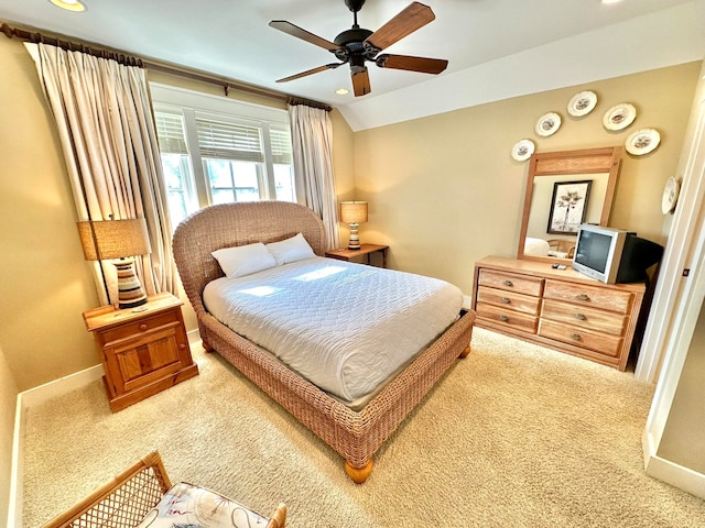 carpeted bedroom featuring ceiling fan and lofted ceiling