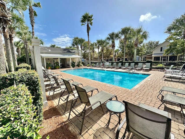 view of swimming pool featuring a patio area