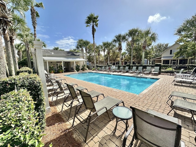 2450 Bungalo Ln, Miramar Beach, FL 32550 - community pool featuring a patio and fence