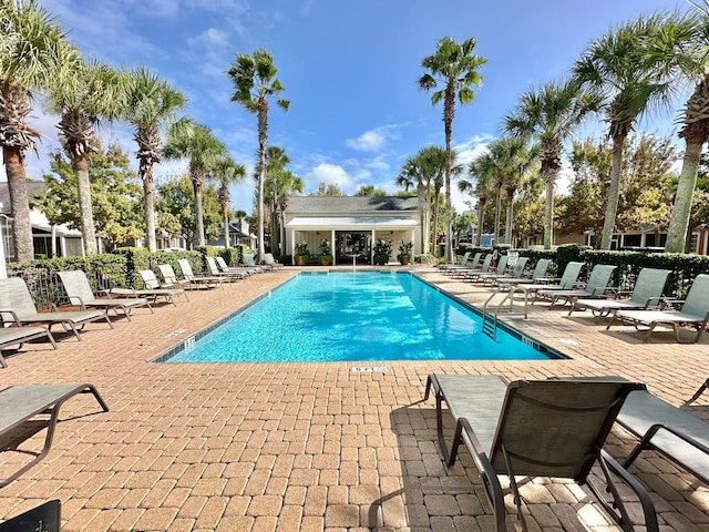 view of swimming pool with a patio area