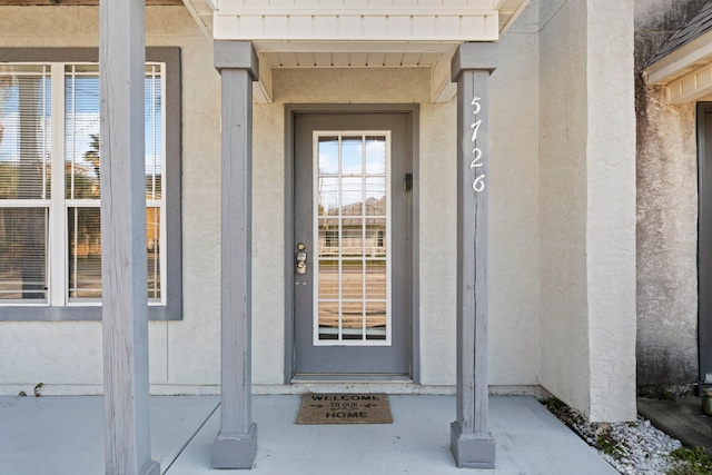 doorway to property featuring a water view