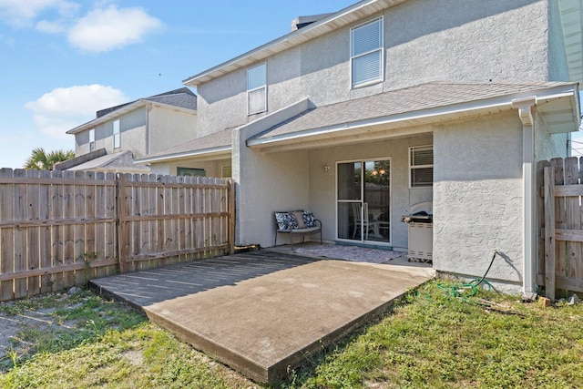 back of property featuring a patio area