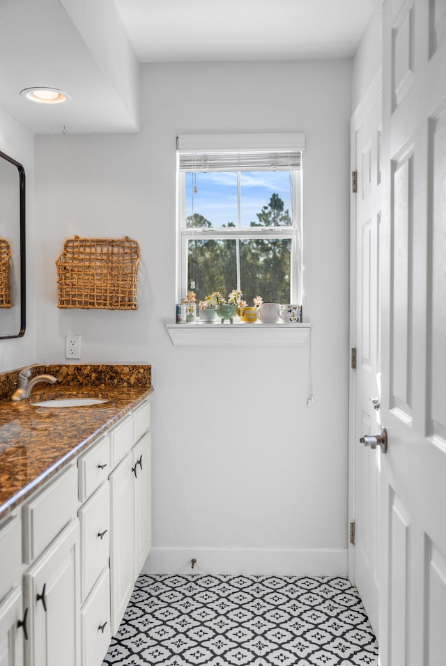 bathroom featuring tile patterned floors and vanity