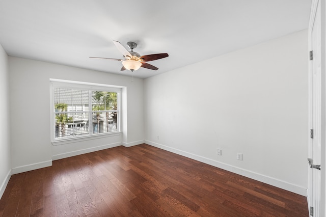 unfurnished room featuring ceiling fan and dark hardwood / wood-style floors