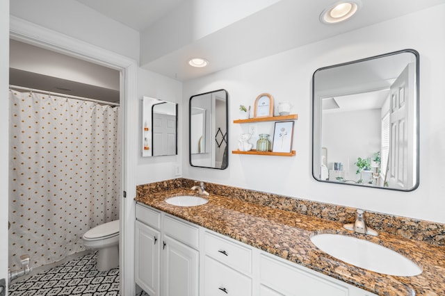 bathroom with a shower with curtain, vanity, and toilet